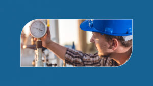 Worker inspecting a pressure gauge