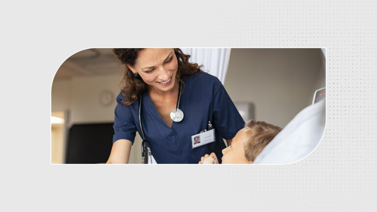 Doctor sitting on a patient's bed, smiling