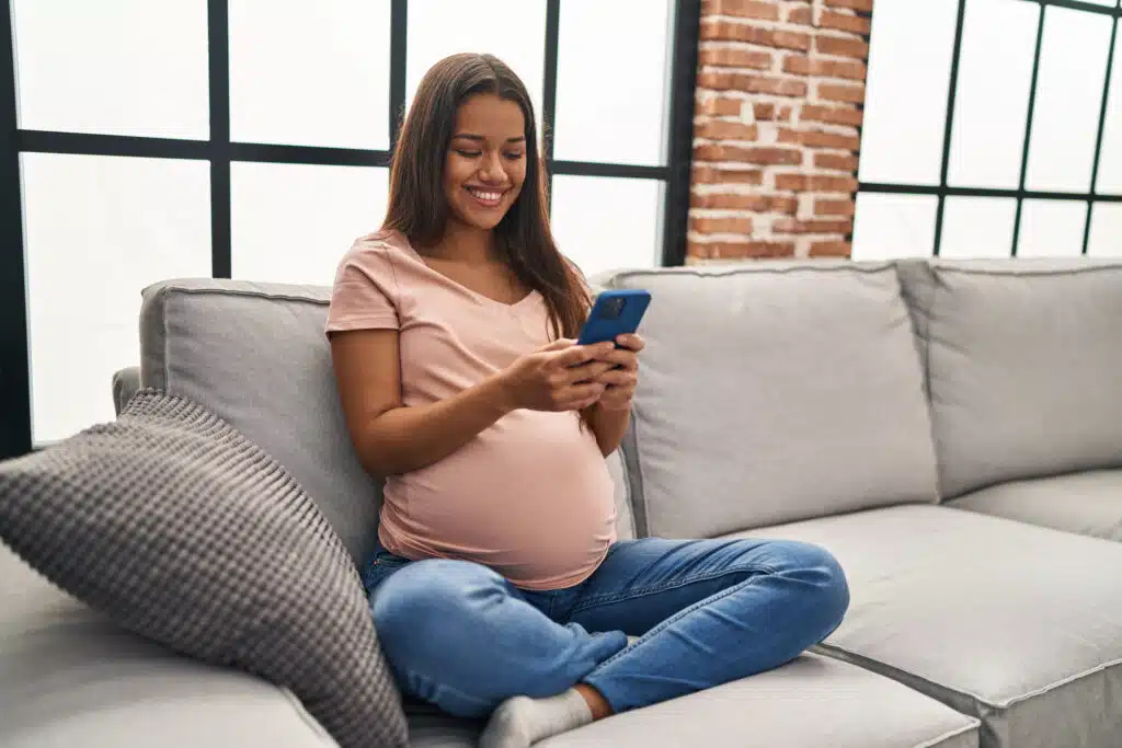 pregnant woman using phone