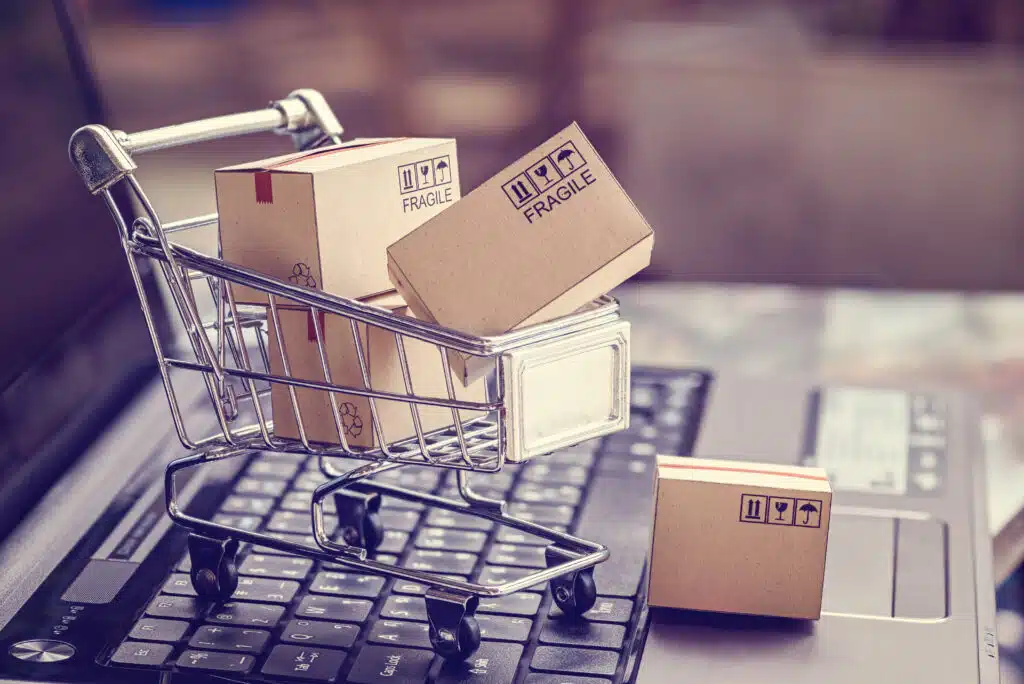 boxes in shopping cart on laptop